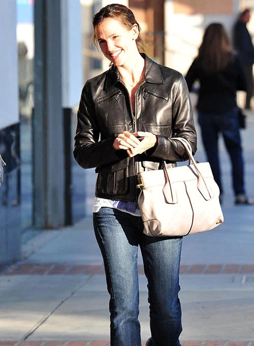 Jennifer Garner's chic outfit featuring a tailored leather jacket and ankle boots in German market